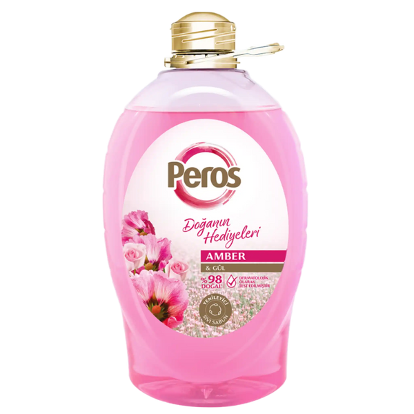 Pink bottle of Peros laundry detergent with floral design on a white background